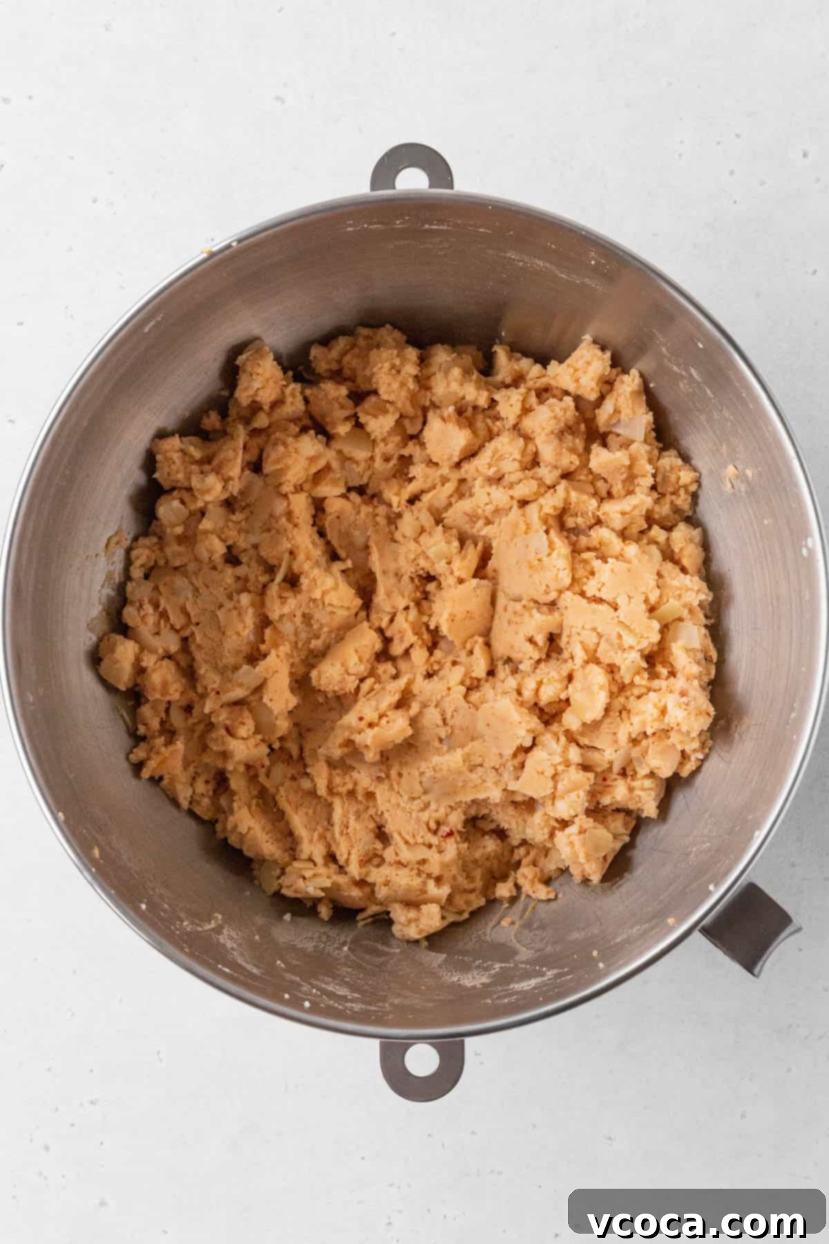 Plant-Powered Potato Croquettes 11 Vegan potato croquette mixture is pale orange and thick.