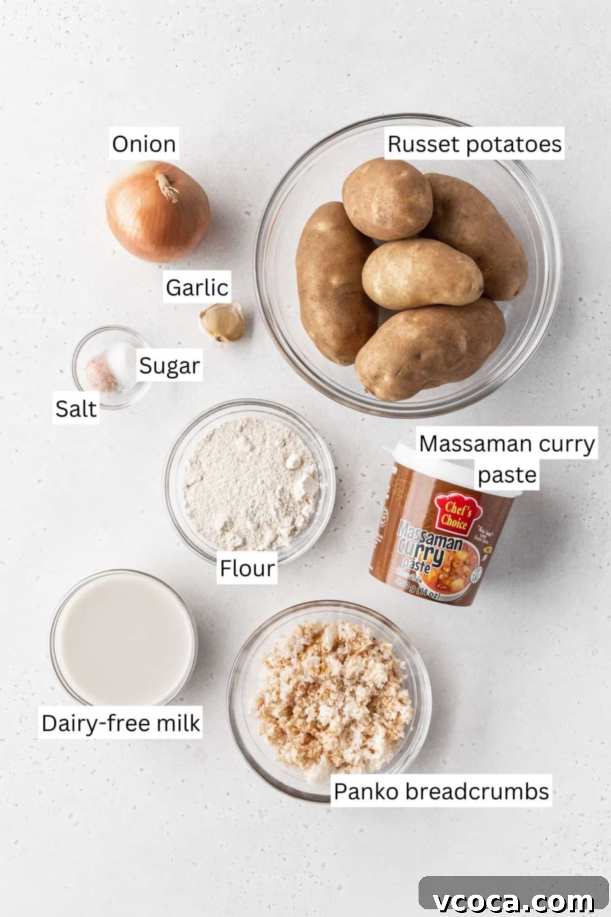 Plant-Powered Potato Croquettes 5 Ingredients for making vegan potato croquettes measured out into bowls on a white surface with text overlay.