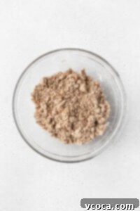Gluten-free crumb cake topping in a glass bowl.