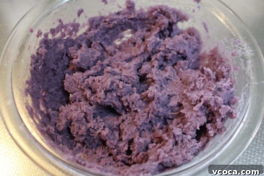 Mashed purple sweet potatoes, ready to be rolled into balls for the Halloween eyeballs.