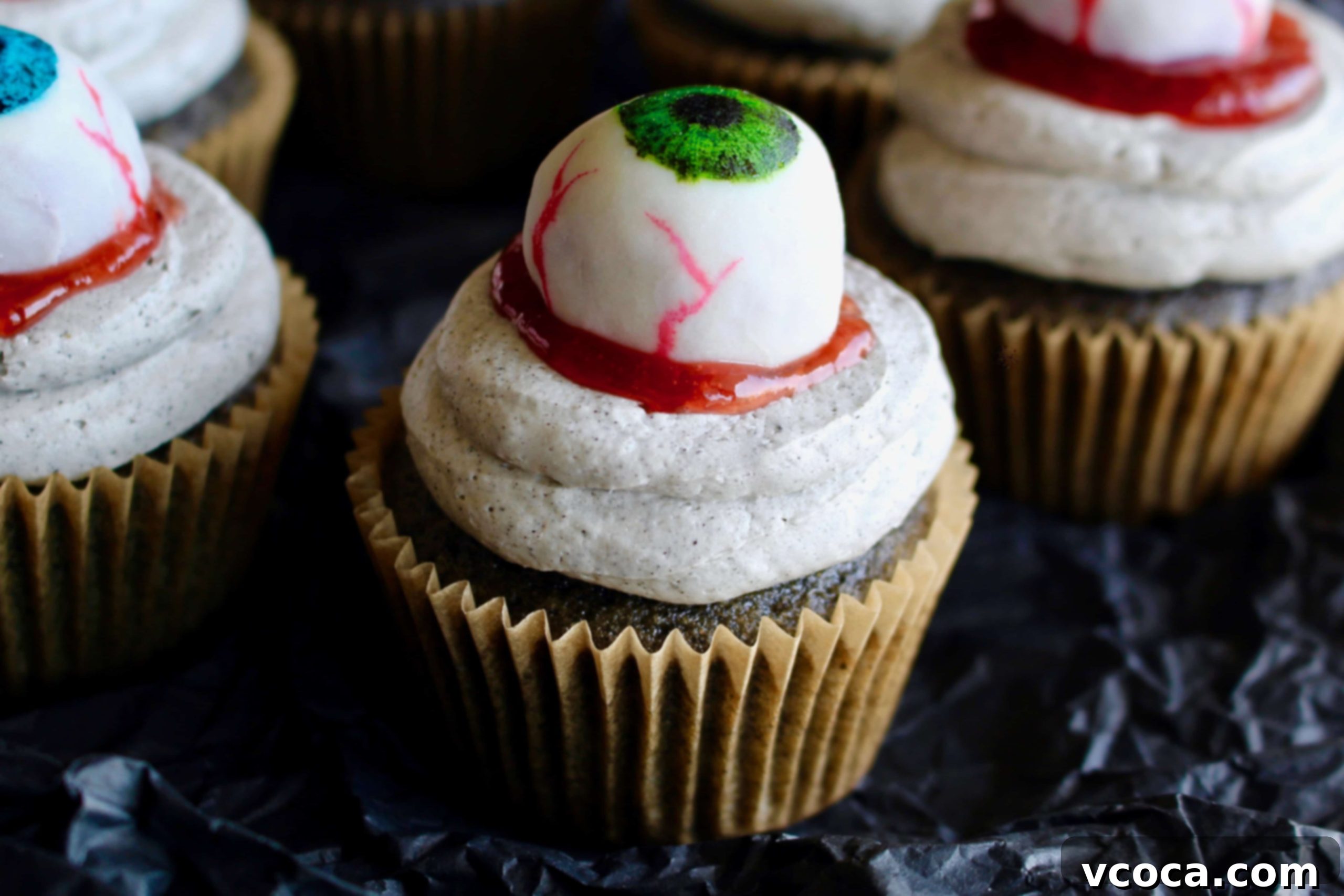 Spooky Black Sesame Eyeball Cupcakes 9 Halloween black sesame cupcakes are the perfect unique treat for an adult Halloween party! These Halloween eyeball cupcakes have a fluffy black sesame cake topped with black sesame buttercream frosting, topped with my Halloween white chocolate eyeballs! I added a spoonful of berry jam as fake blood, but I think mixing some black tahini with honey to make a spooky black goop would pair better in terms of taste.