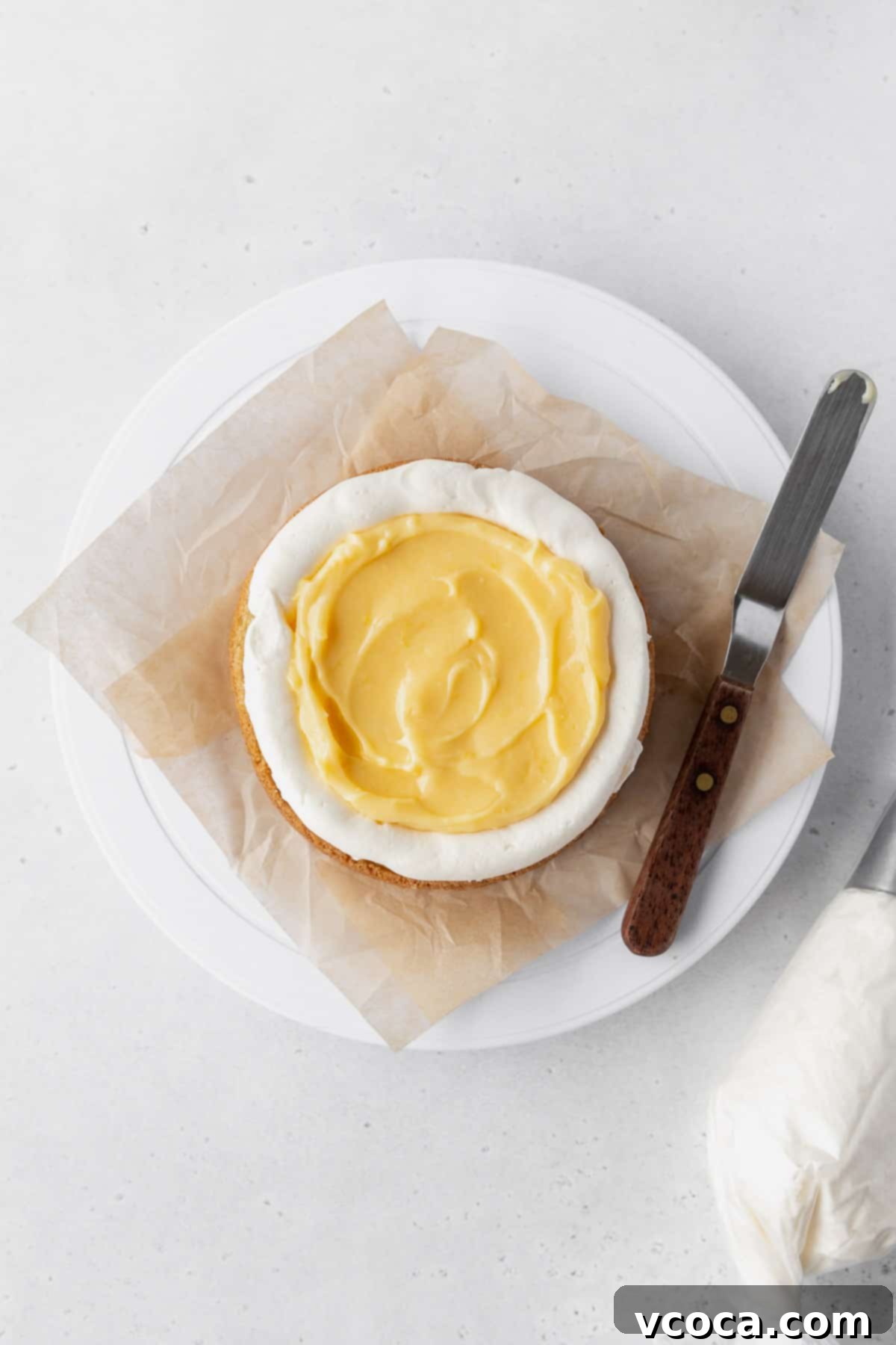 Luscious Lemon Curd Cake 24 Flooding the center of the cake layer with lemon curd.