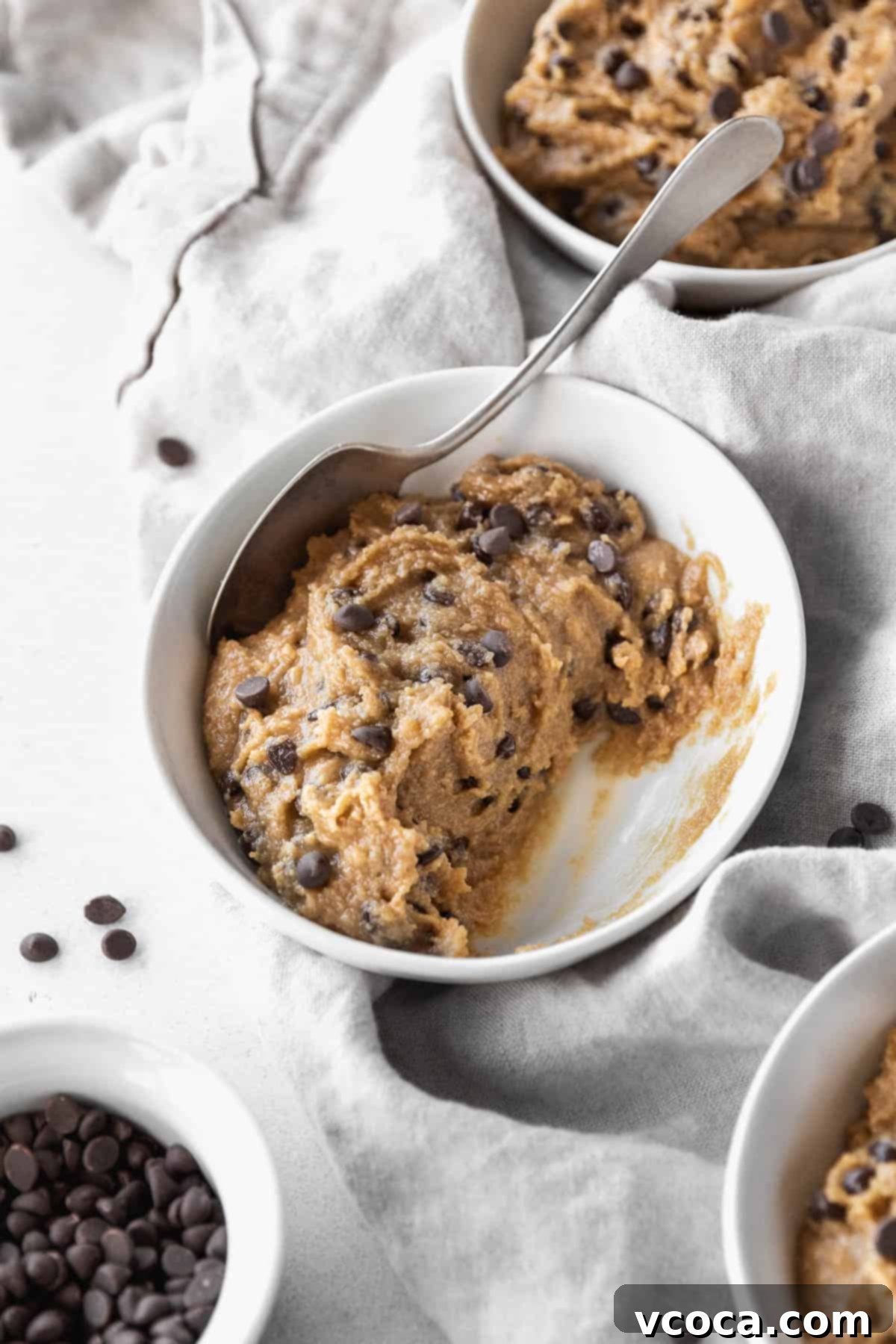No-Bake Gluten-Free Cookie Dough 11 45 degree angle shot of a half-eaten bowl of dairy-free gluten-free edible cookie dough.