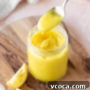 Square hero of vegan lemon curd in a mason jar, perfectly smooth and vibrant.