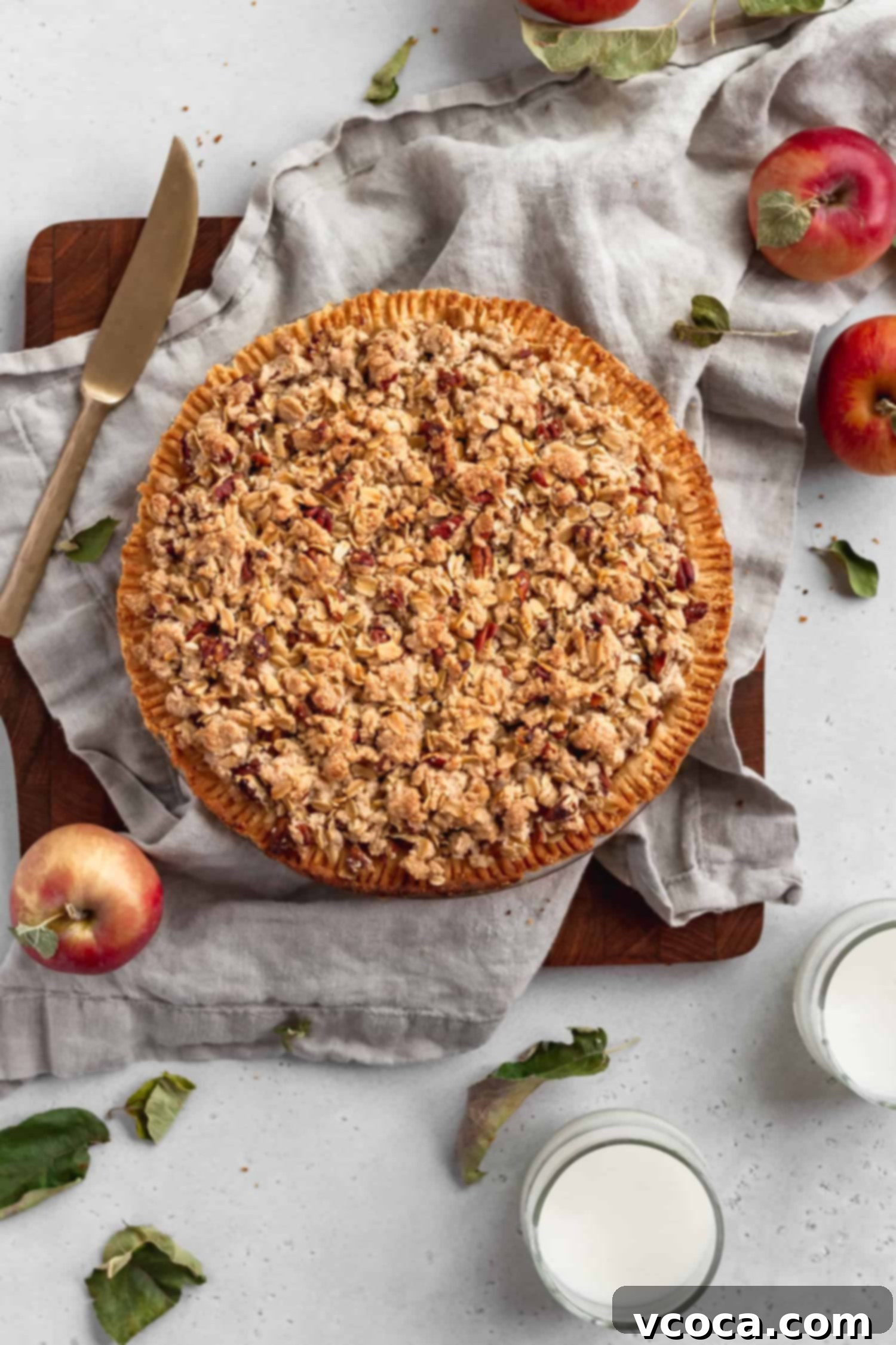 Gluten Free Dutch Apple Crumble Pie 2 A whole gluten-free apple crumble pie with a golden, crumbly topping and a hint of the flaky crust peeking through