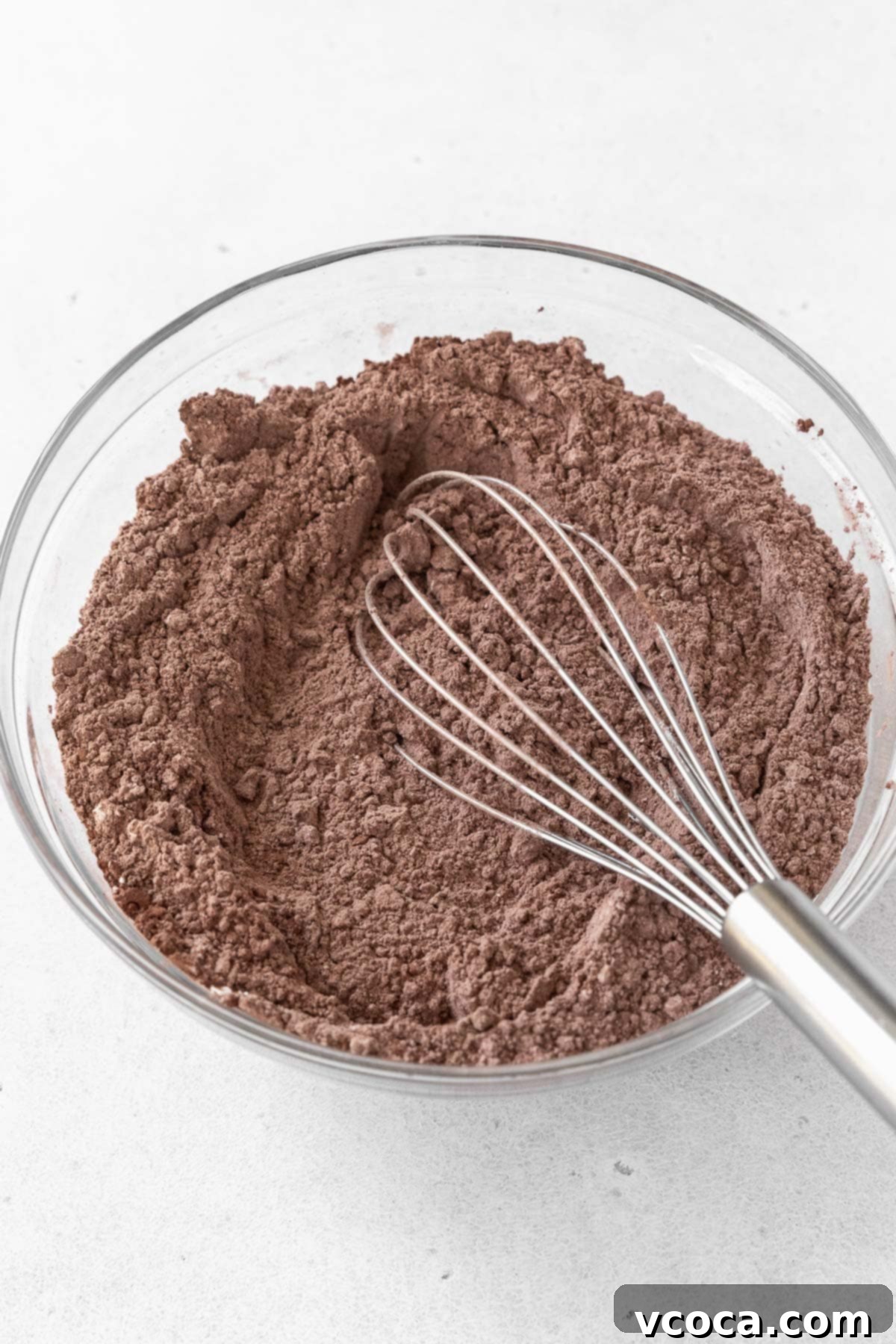 Guilt-Free Frozen Indulgence 5 A glass mixing bowl of flour and cocoa.