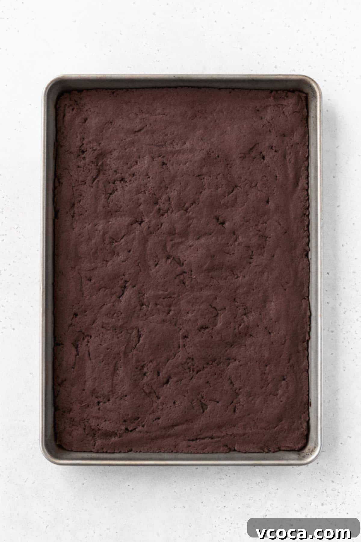 Guilt-Free Frozen Indulgence 9 Baked chocolate ice cream sandwich cooking on a baking sheet.