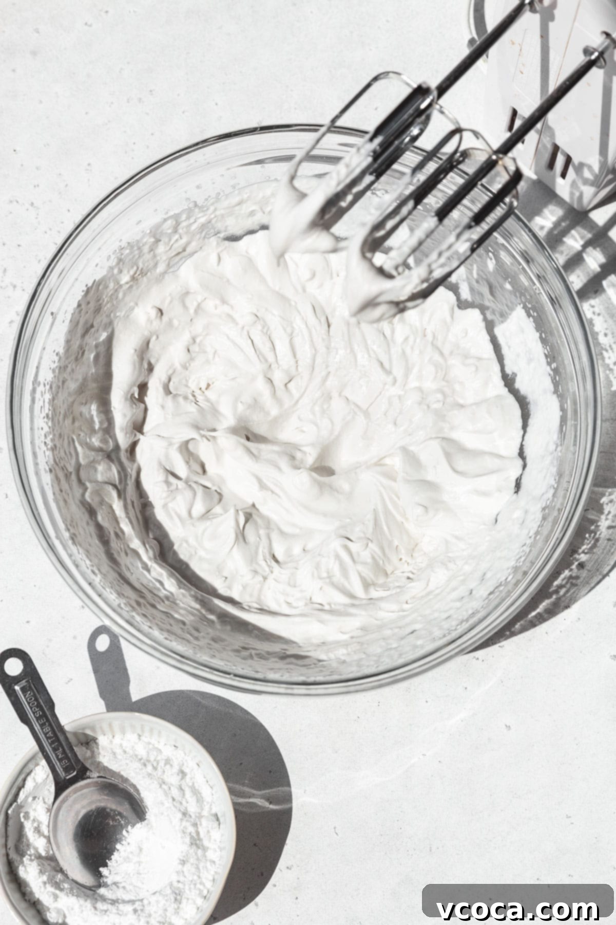 Divine Vegan Coconut Cream Pie Gluten Free 13 Vegan whipped cream in a mixing bowl after beating to stiff peaks.
