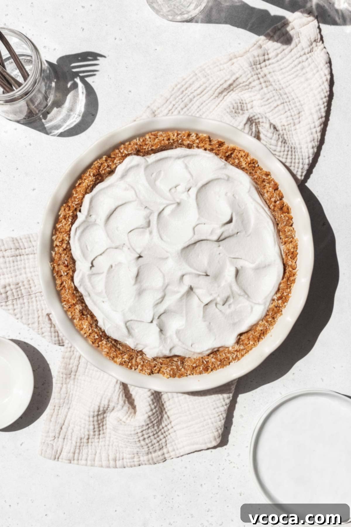 Divine Vegan Coconut Cream Pie Gluten Free 14 Whipped coconut cream swooshed on top of the vegan coconut custard in the gluten-free pie shell.