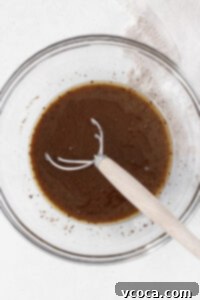 Whisking the wet whoopie pie ingredients together.