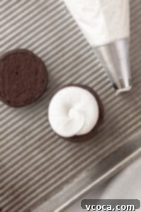 Filling the whoopie pie with the filling.