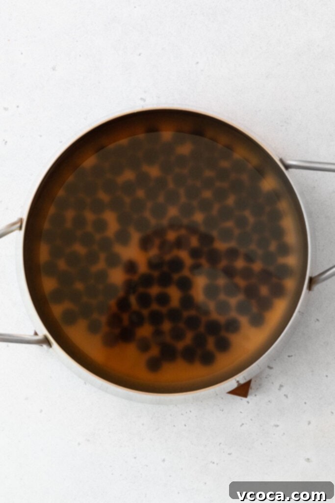 Tropical Mango Boba 5 Cooking boba pearls in a large pot.