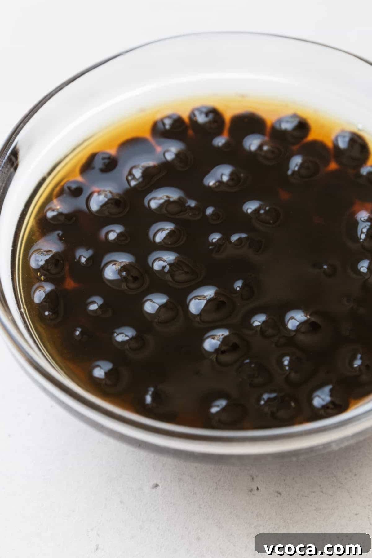 Tropical Mango Boba 7 Soaking boba pearls in a small bowl of brown sugar simple syrup.