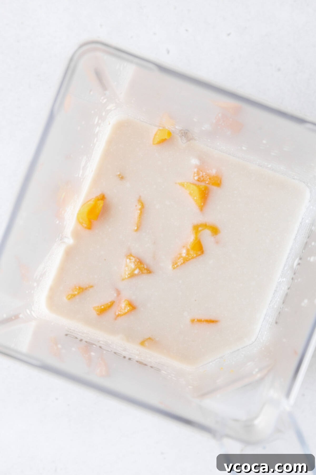 Tropical Mango Boba 9 Cubed mango, tea, and coconut milk in a blender.