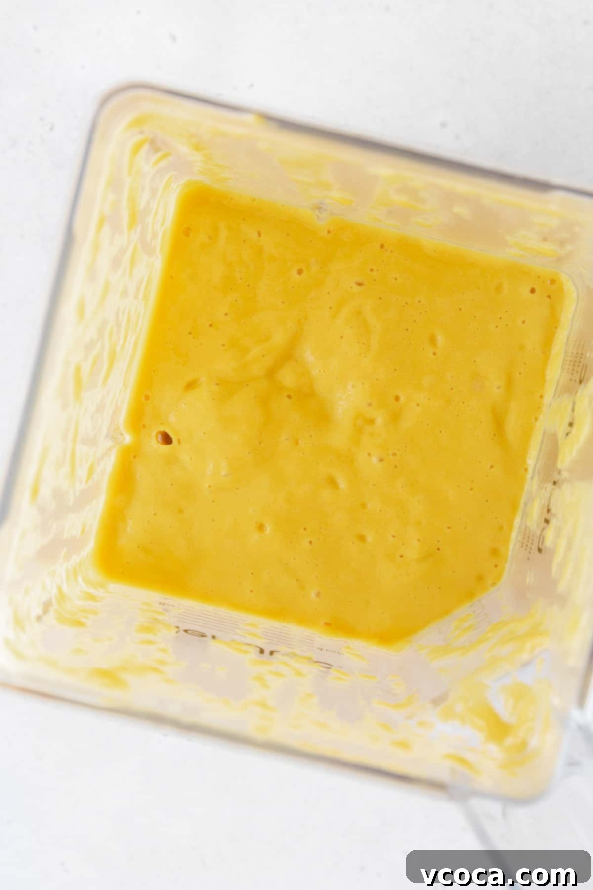 Tropical Mango Boba 10 Blended up mango puree in a blender.