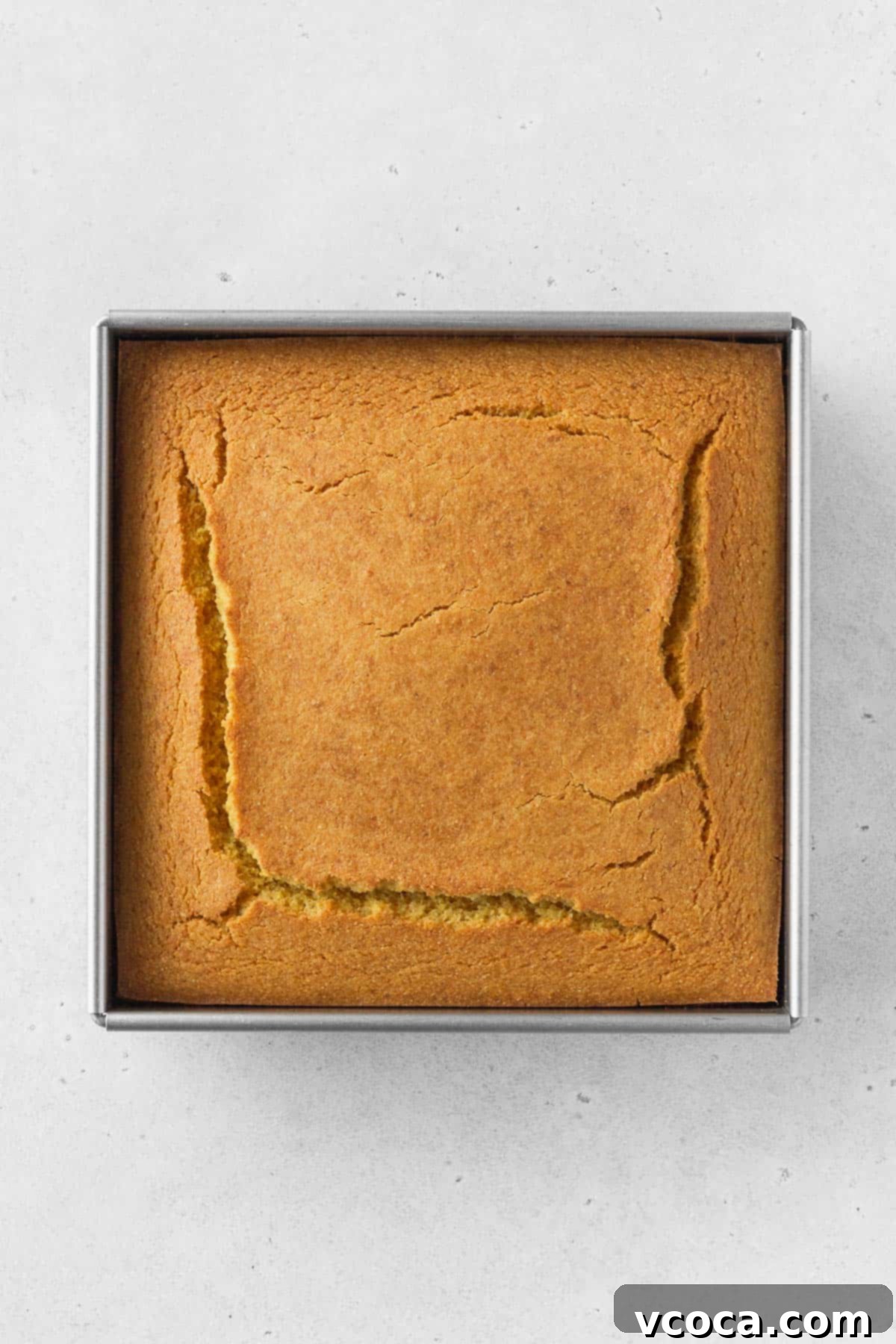 An overhead shot of a pan of baked cornbread.