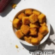 Close-up shot of a small dish of cornbread croutons.