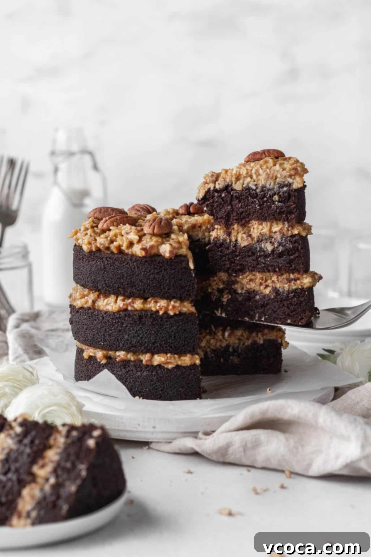27 Reader-Favorite Gluten-Free Dairy-Free Treats 3 Taking a slice out of gluten-free German chocolate cake.
