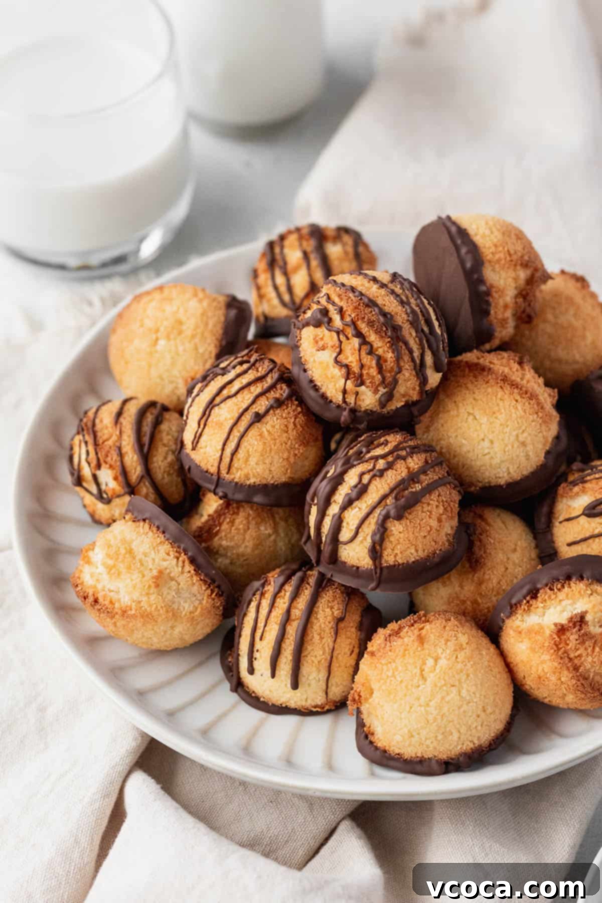 27 Reader-Favorite Gluten-Free Dairy-Free Treats 8 A white plate of the dairy-free macaroons on top of a napkin.