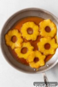 The pineapple and brown sugar mixture in a skillet.