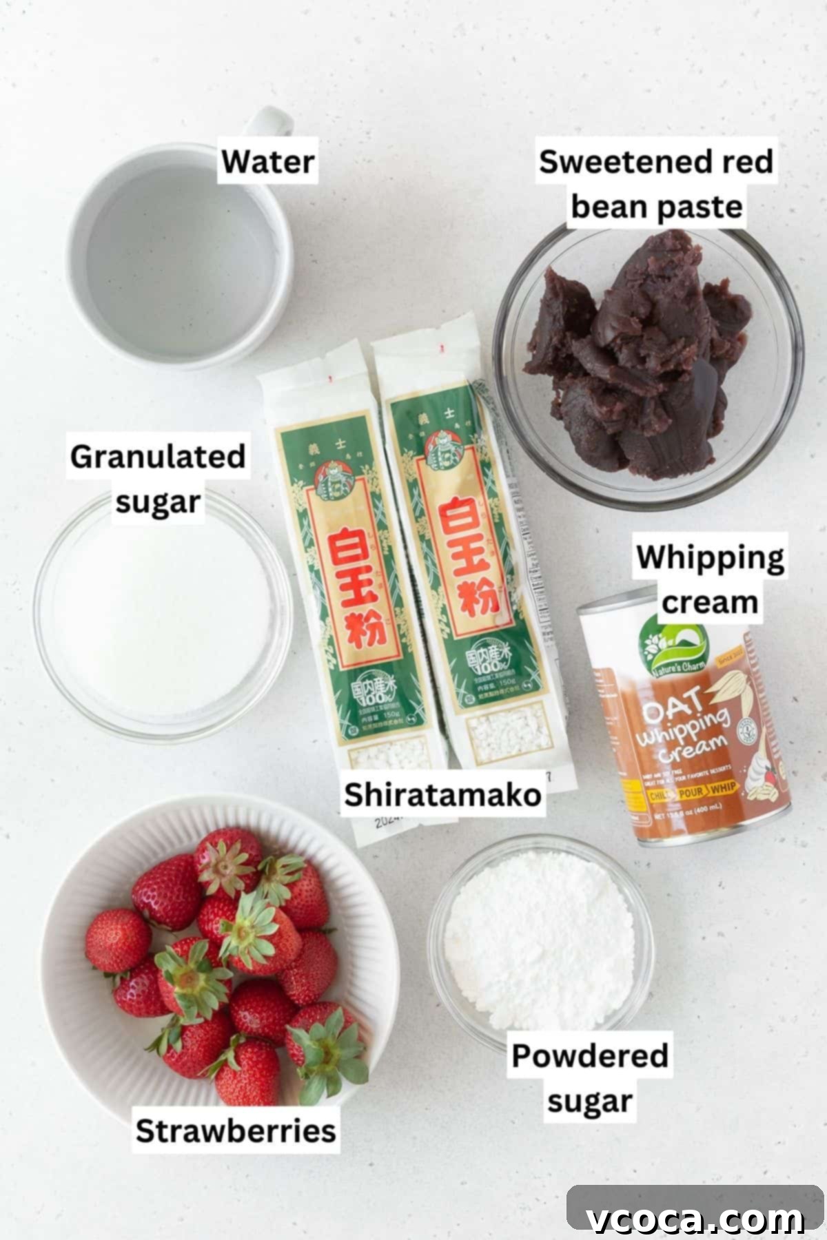 All the vibrant Ichigo Daifuku ingredients, including fresh strawberries, shiratamako, sugar, and anko, meticulously measured out into separate bowls, ready for preparation.