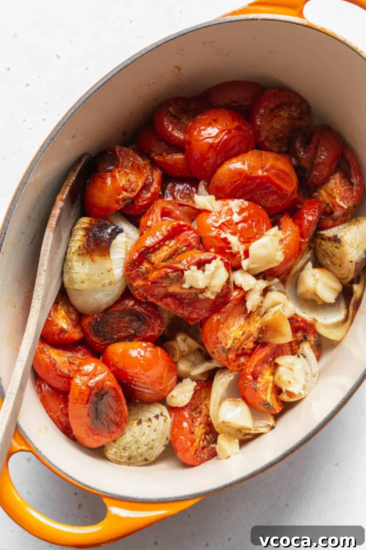 Heartwarming Roasted Tomato Soup 8 A large pot brimming with beautifully roasted tomatoes, onions, and garlic, ready to be blended into soup.