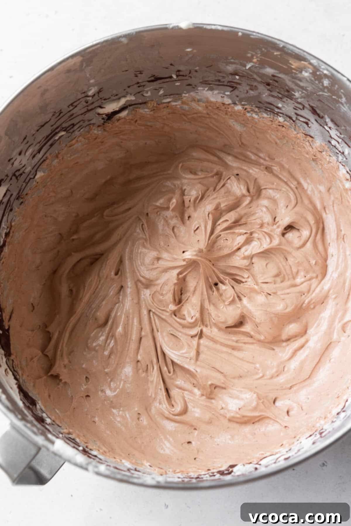 Velvety Chocolate Cupcakes 13 Chocolate cream cheese frosting in a metallic bowl.