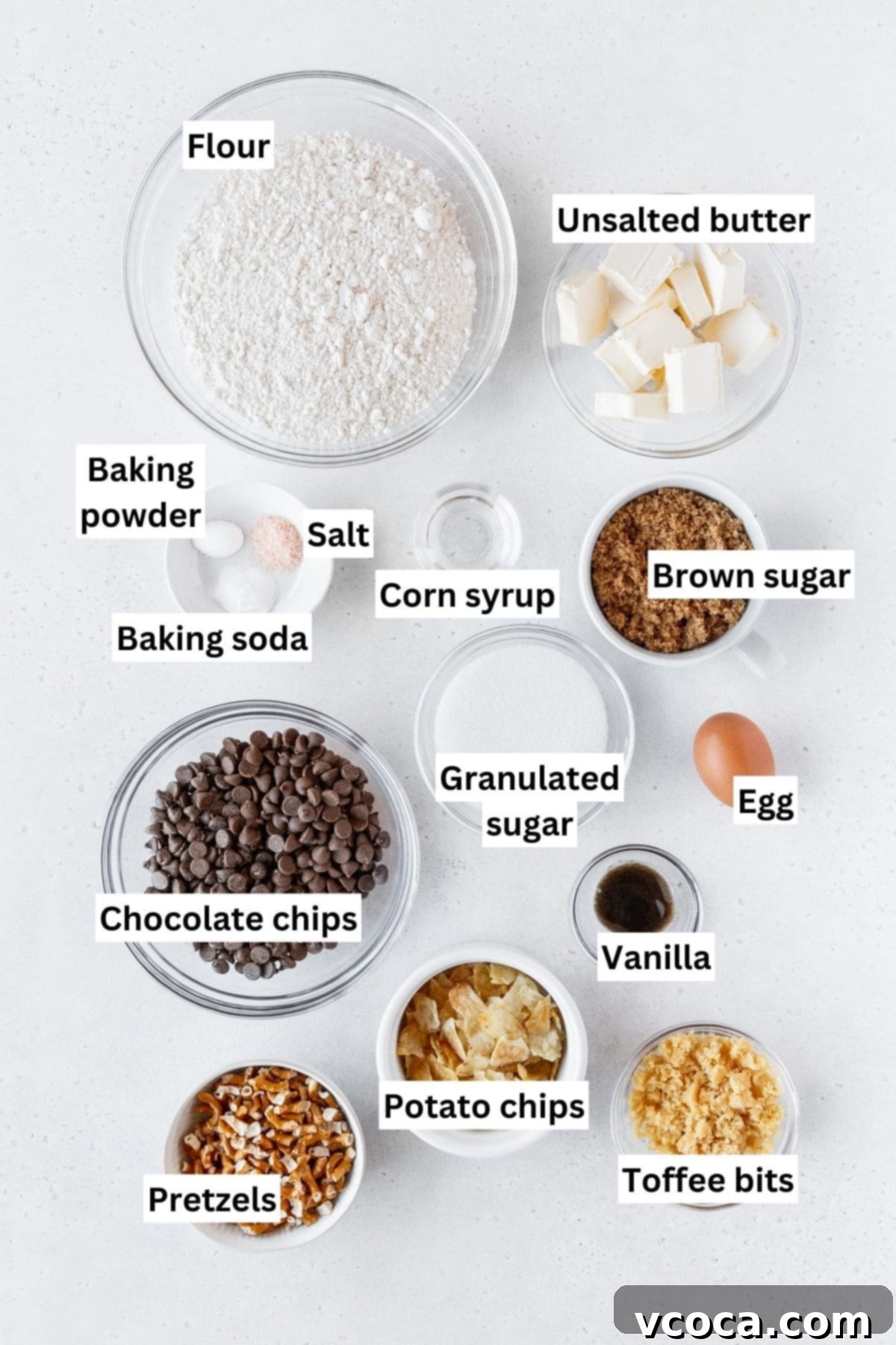 Pantry Raid Cookies 3 Kitchen sink cookie ingredients measured out into bowls on a white surface with text overlay.