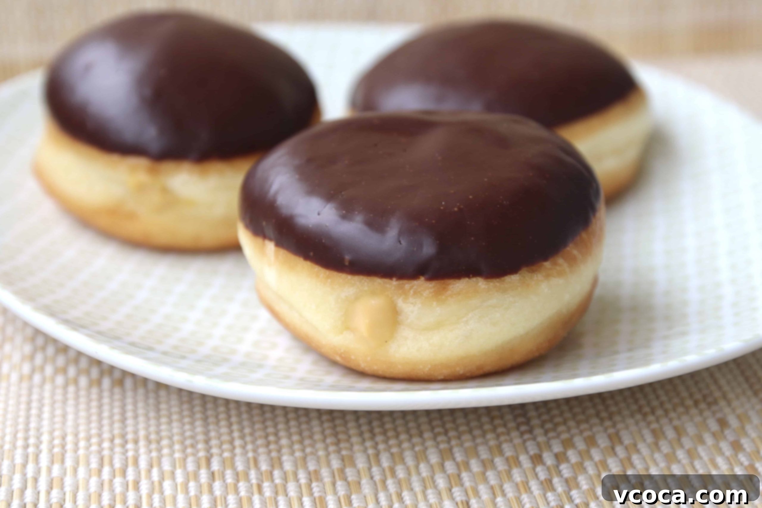 Irish Cream Boston Doughnut Bliss 4 Baileys Boston cream doughnuts on a plate