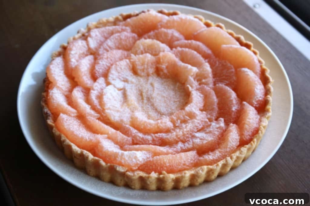 Zesty Grapefruit Tart 6 Fresh grapefruit segments artfully arranged on top of a grapefruit curd tart.
