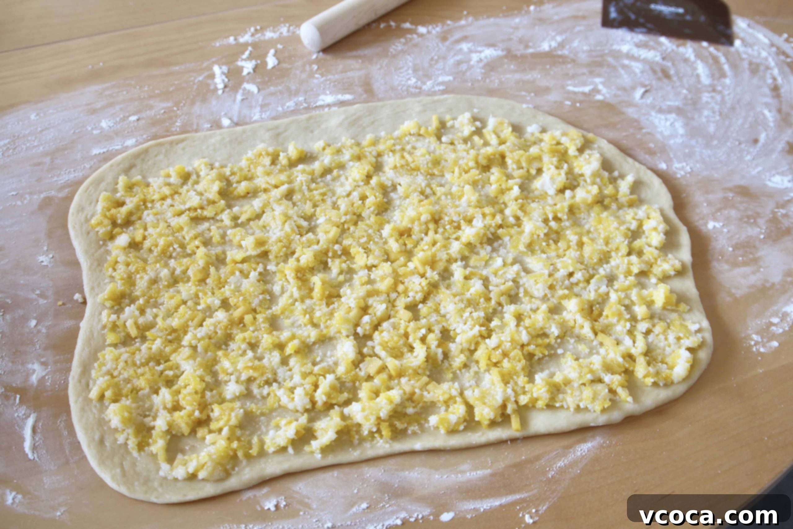 Tropical Piña Colada Swirls 6 Piña colada rolls dough, spread with filling and ready to be rolled up into a log