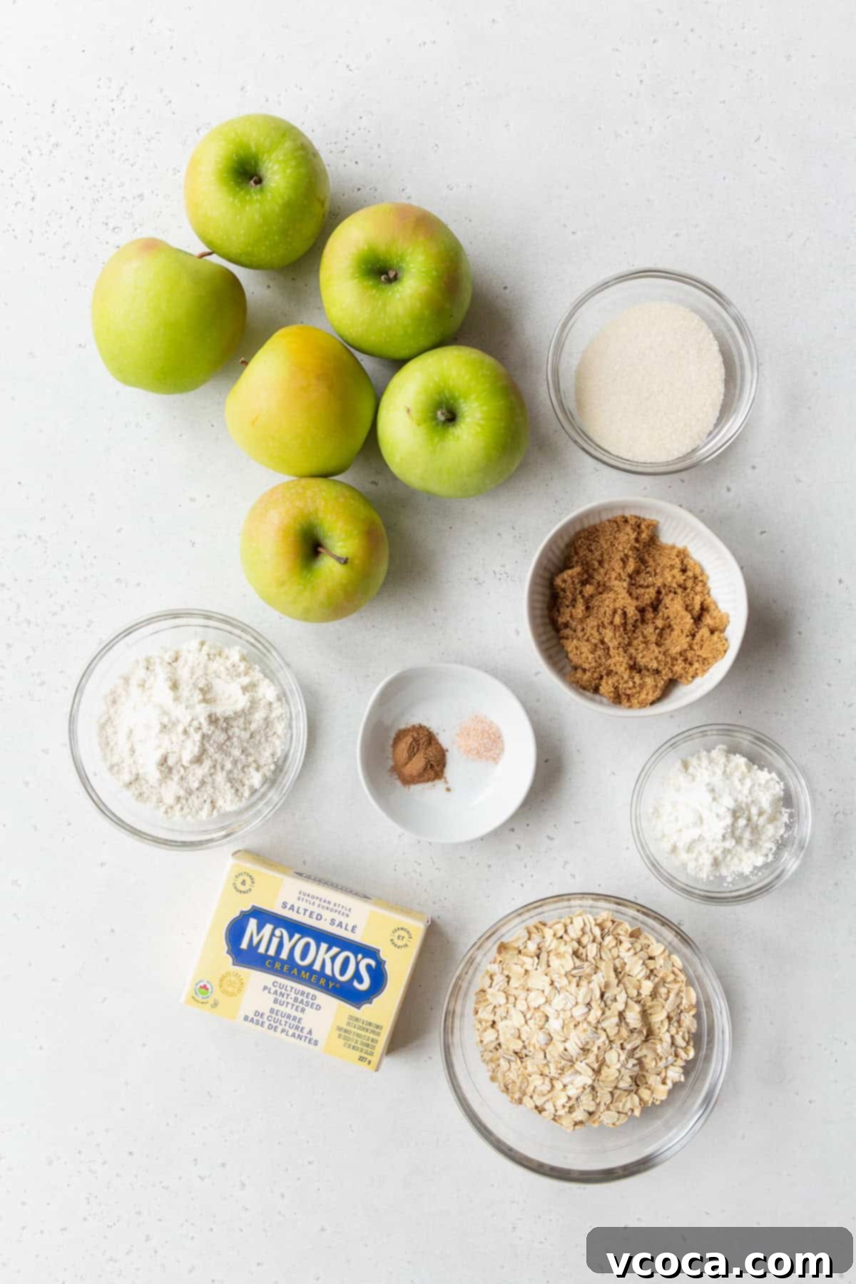 Comforting Gluten-Free Apple Crisp 3 Ingredients to make gluten-free apple crisp on a light grey surface