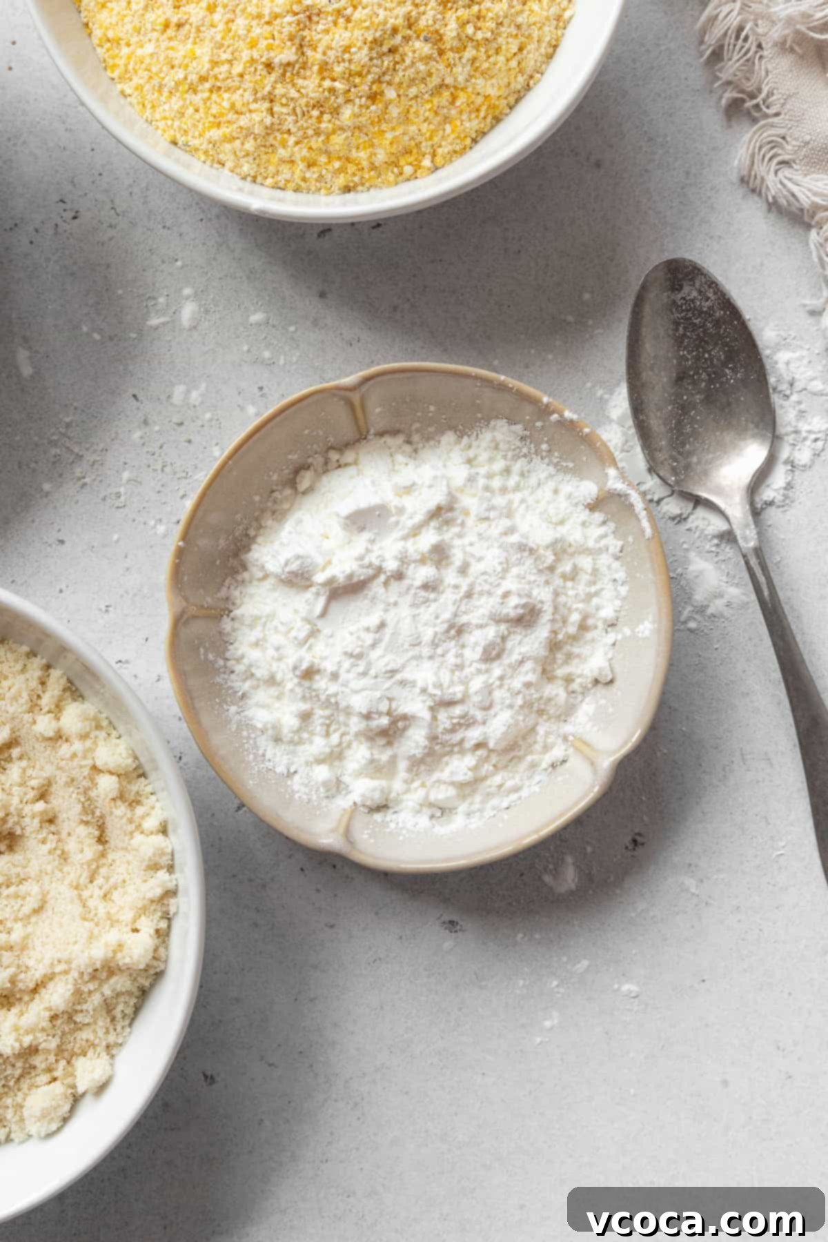 My Go-To Gluten Free Flours 5 A small dish of cornstarch with a spoon next to it.