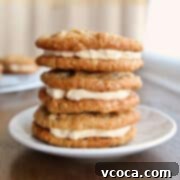 Scrumptious Chewy Coconut Oatmeal Cookie Sandwiches 6 A stack of 3 oatmeal cream pies on a dessert plate.