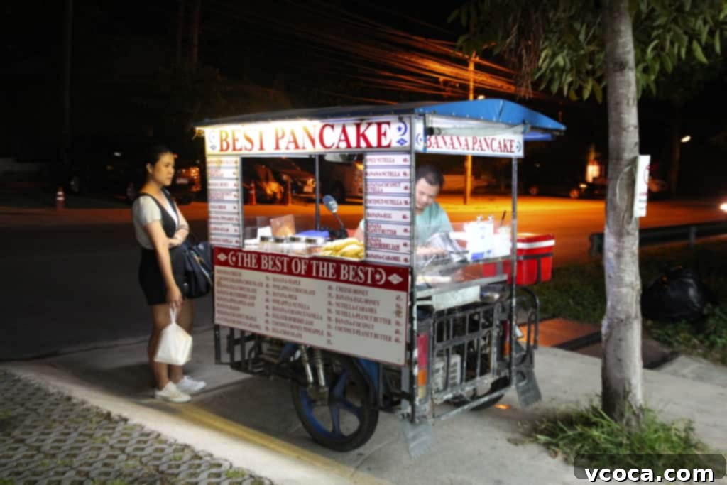 Our Koh Samui Honeymoon Delivered More Than Memories 5 A bustling street food stall in Koh Samui, Thailand, showcasing a variety of colorful and tempting snacks.