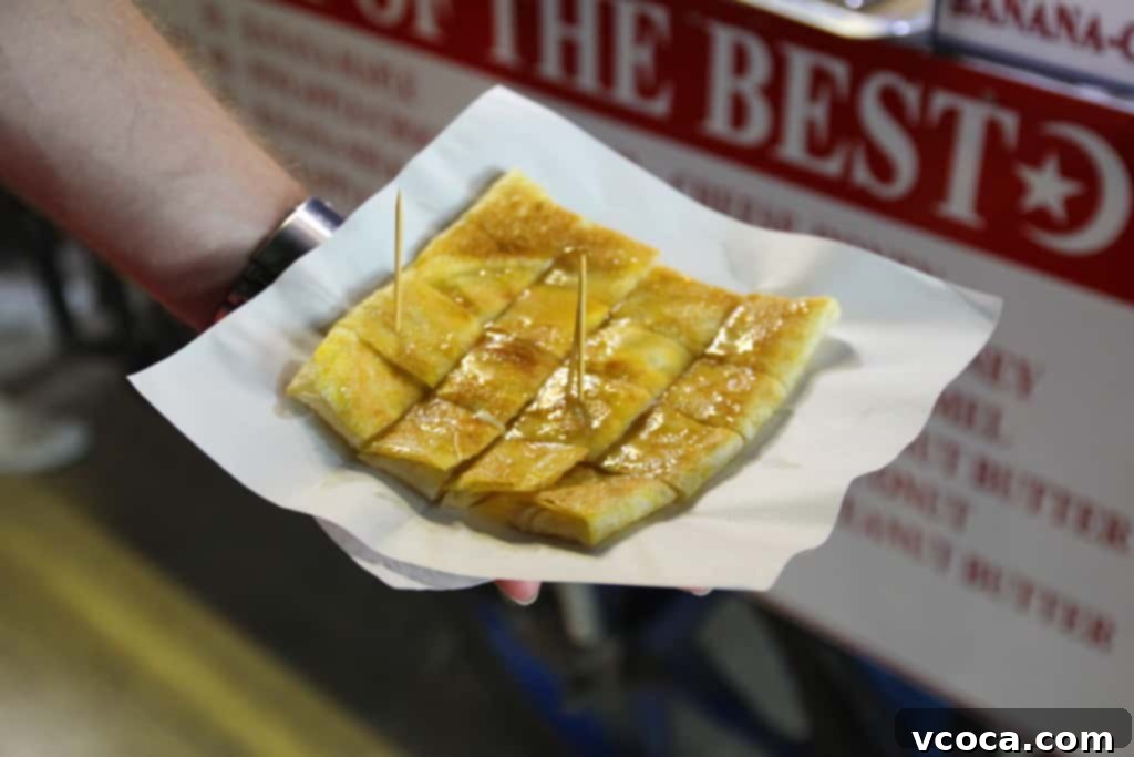Our Koh Samui Honeymoon Delivered More Than Memories 6 A delicious grilled pancake topped with cheese and honey, served on a street stall in Koh Samui, Thailand.