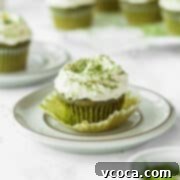 Matcha cupcake with white chocolate frosting on a plate