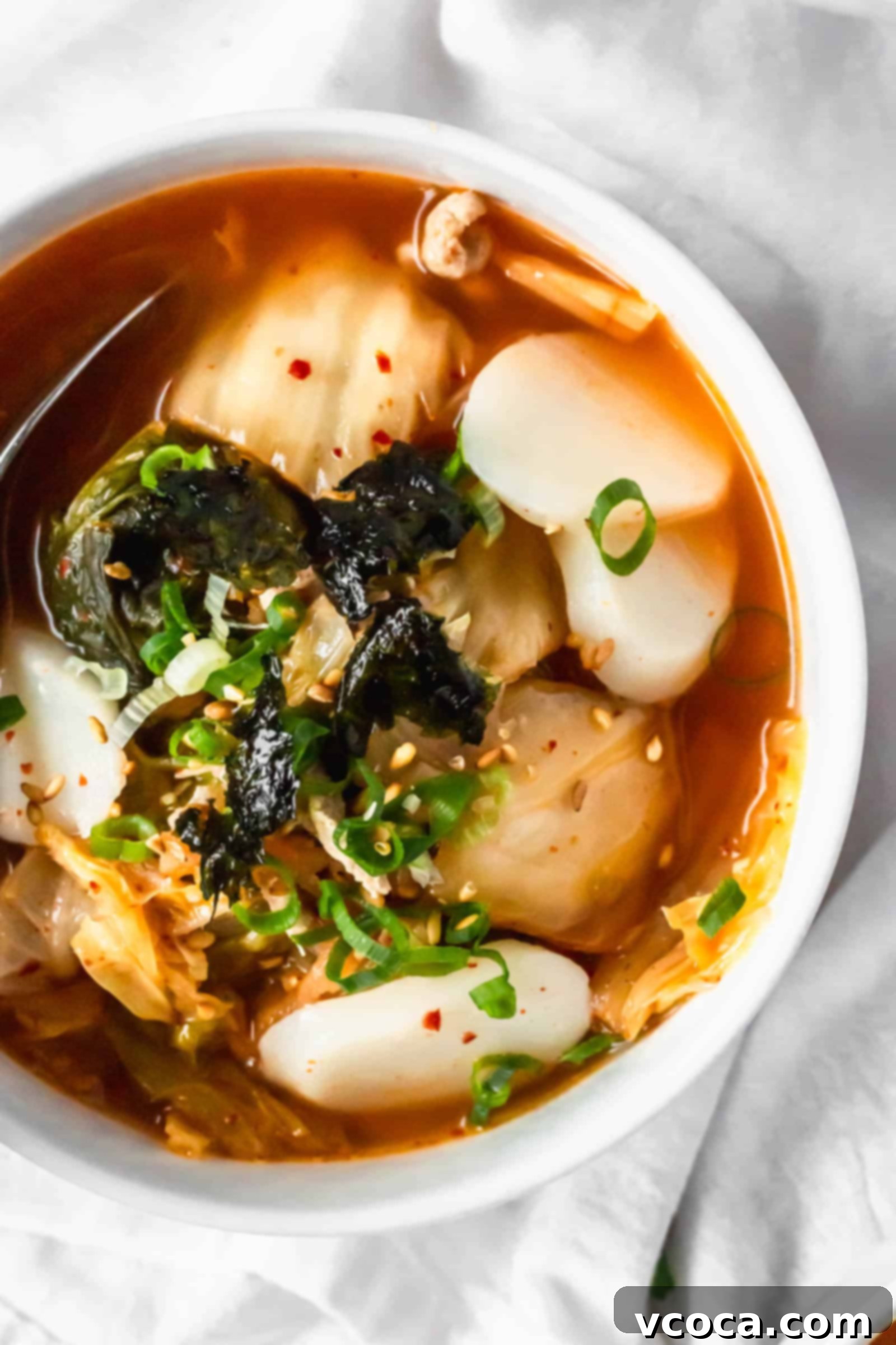 Spicy Kimchi Rice Cake Soup 5 Kimchi soup with Korean tteok rice cakes is spicy, easy, and delicious! Perfect for health-conscious foodies seeking probiotics and authentic Korean flavor. #kimchisoup #probiotics #spicysoup #Koreanfood #healthymeals