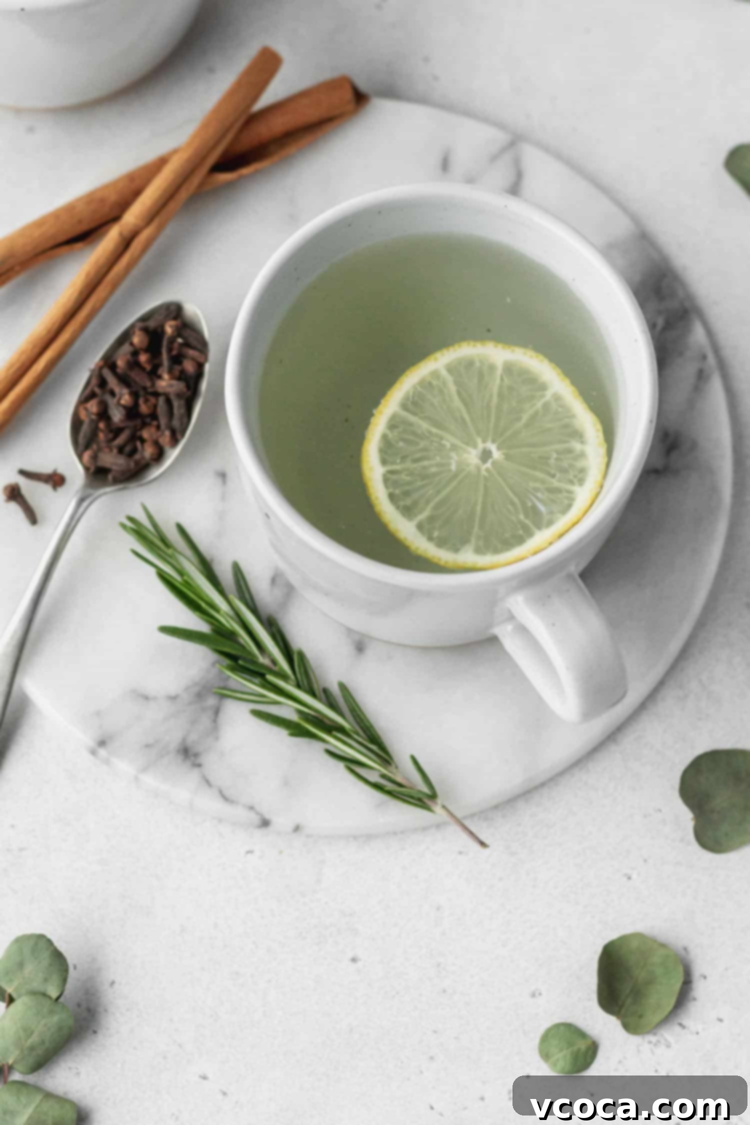 Thieves essential oil tea in a mug, showcasing its warm, inviting essence