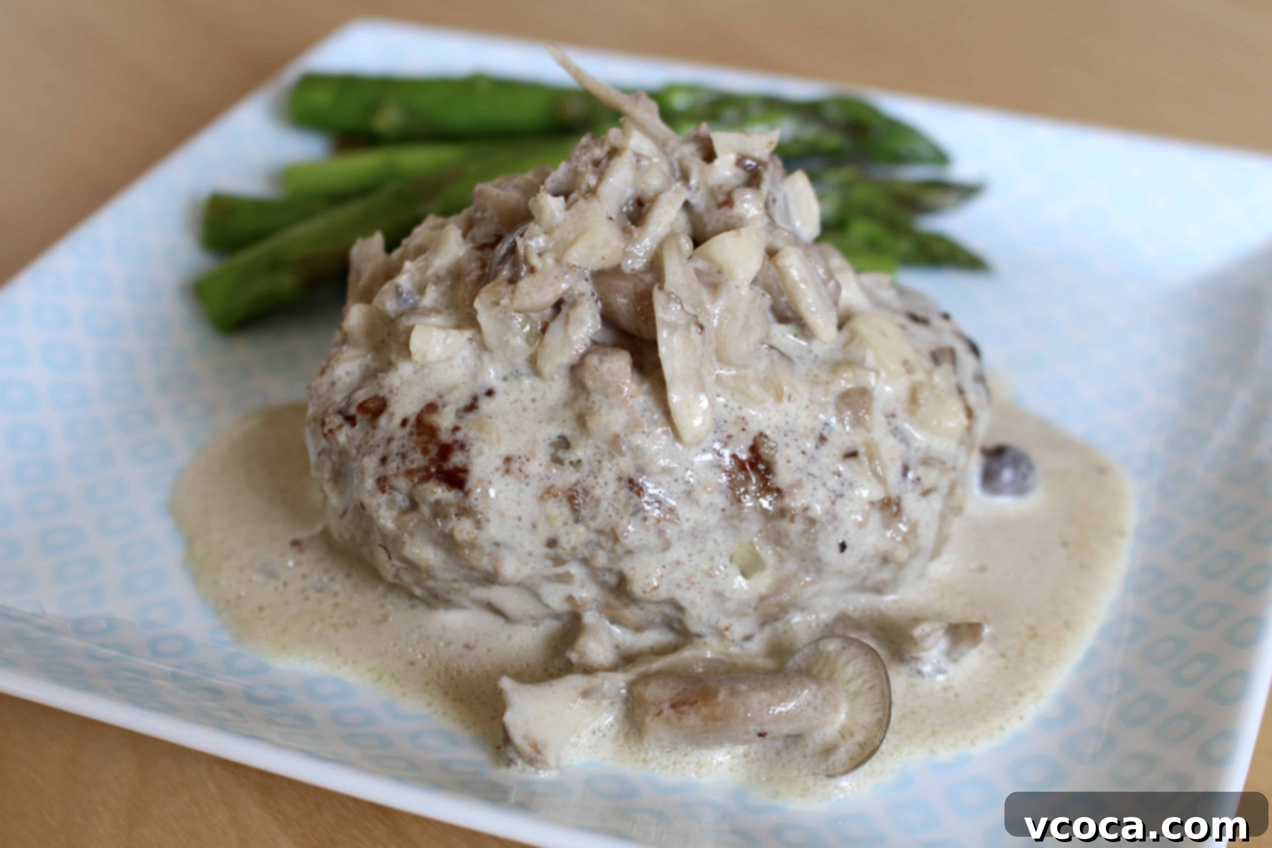 Creamy Mushroom Salisbury Steak 8 Creamy mushroom sauce simmering with Salisbury steak patties in the pan