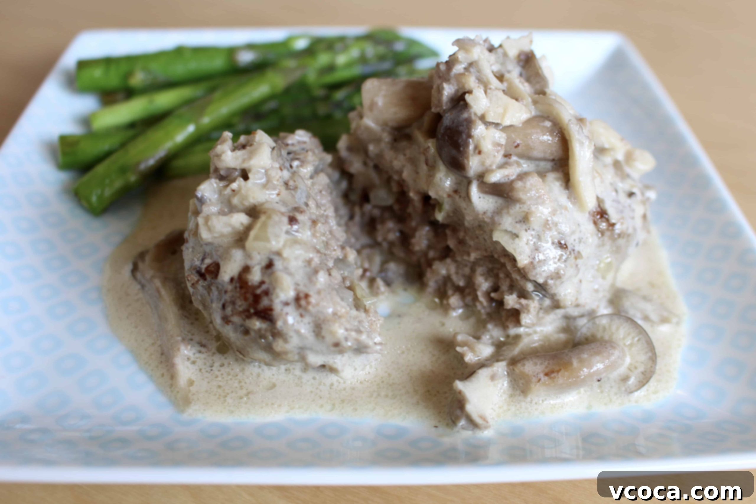 Creamy Mushroom Salisbury Steak 9 Plated Salisbury steak with creamy mushroom sauce and grilled vegetables