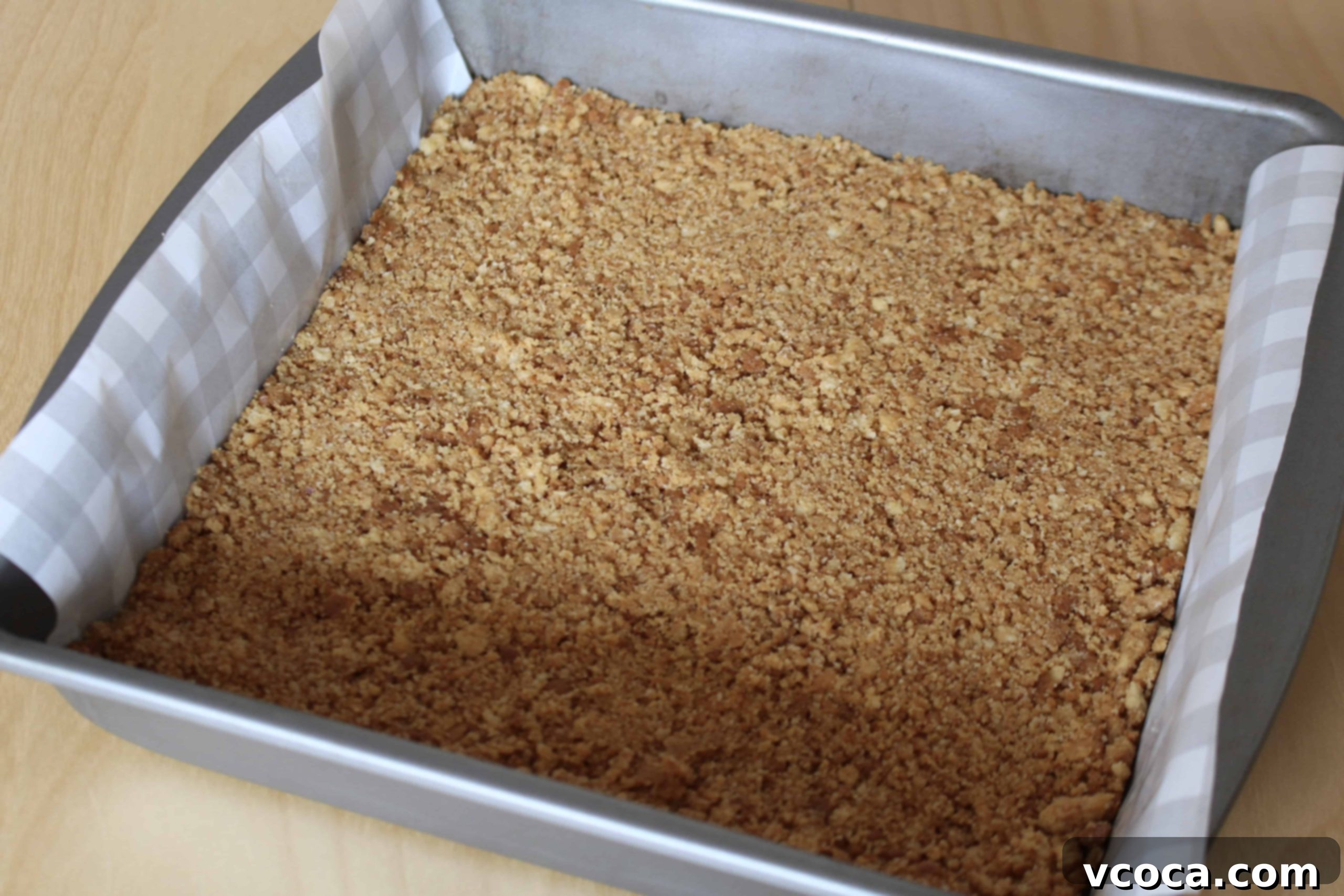 Buttery biscuit crumbs mixed with melted butter for cheesecake crust