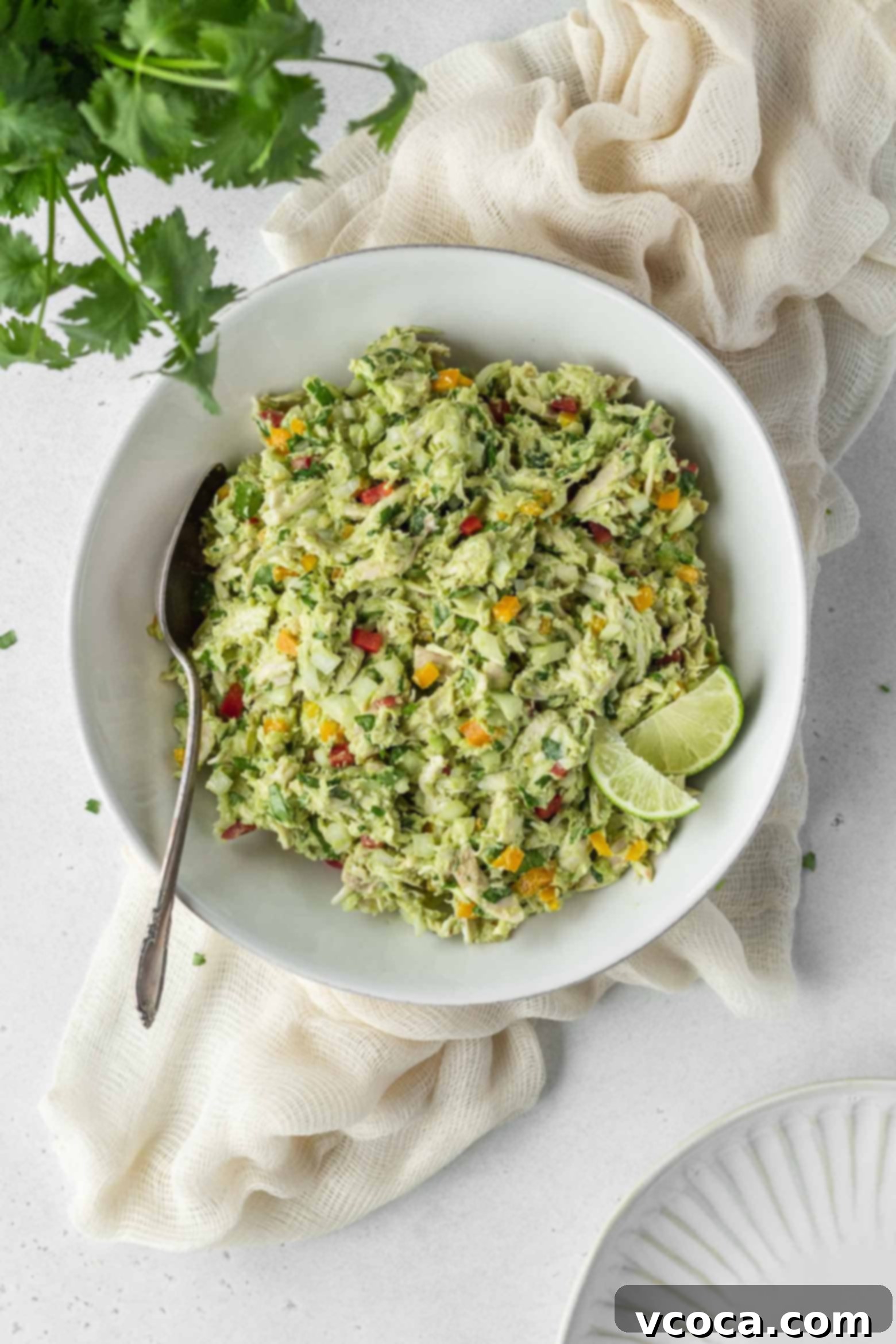 Reina Pepiada Venezuelan Arepas 5 A bowl of creamy chicken and avocado salad, the delicious Reina Pepiada filling