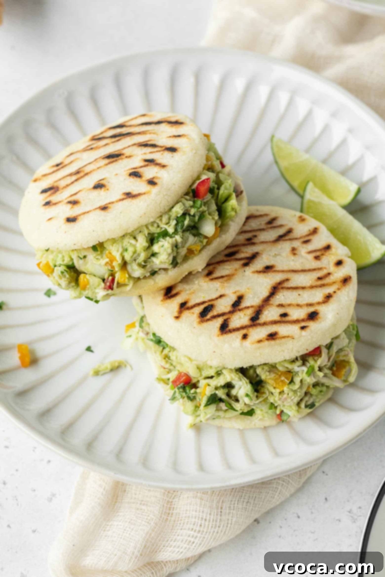 Reina Pepiada Venezuelan Arepas 10 A perfectly prepared Venezuelan arepa with Reina Pepiada filling, garnished with fresh cilantro