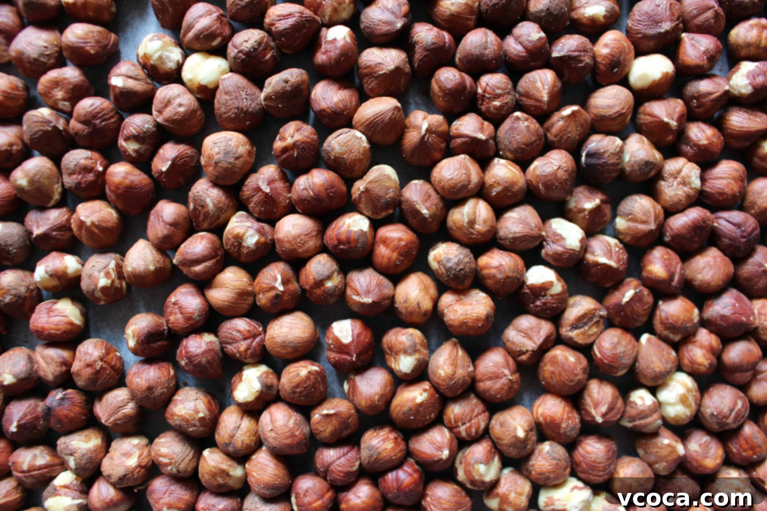 Roasted hazelnuts, a close-up of the delicious, crunchy nuts.