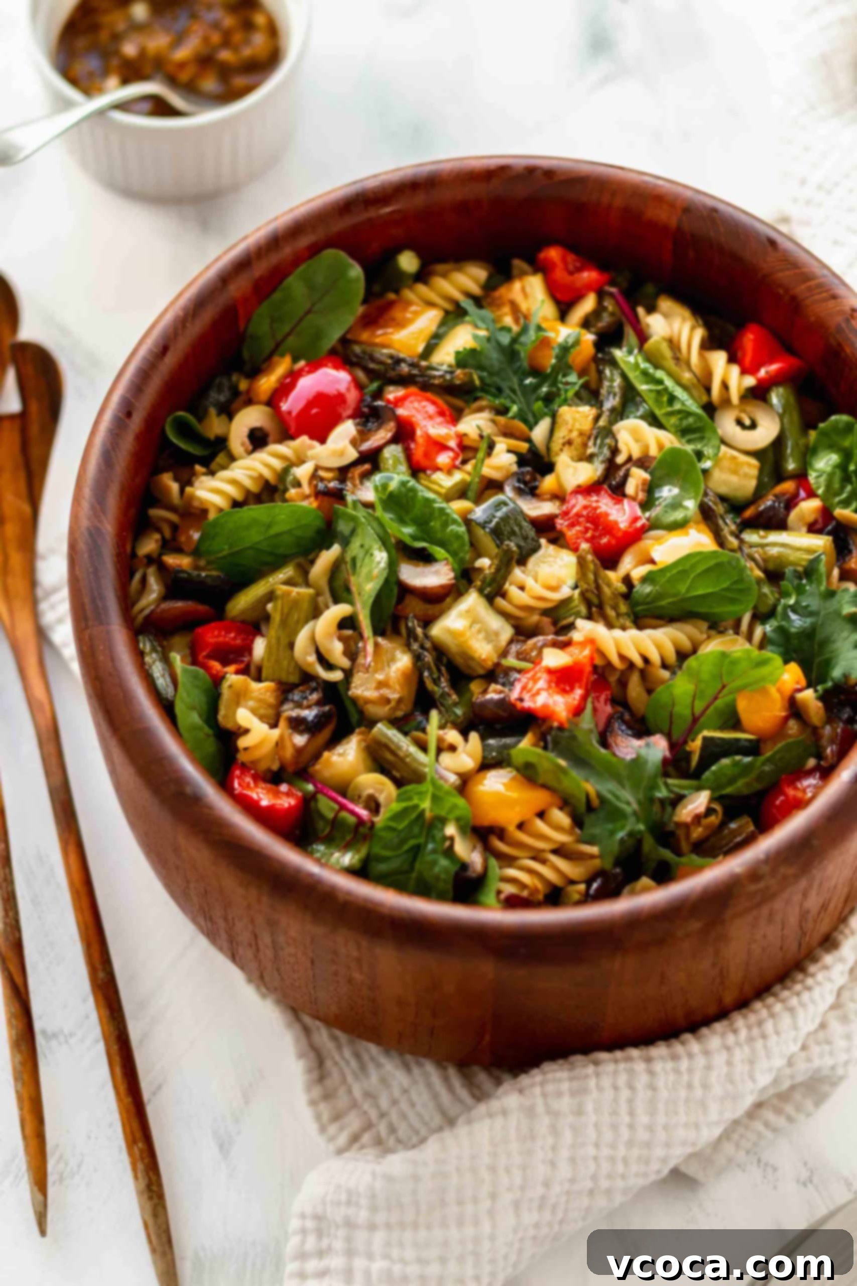 Plant-Based Pasta Salad 7 A wooden bowl of easy pasta salad
