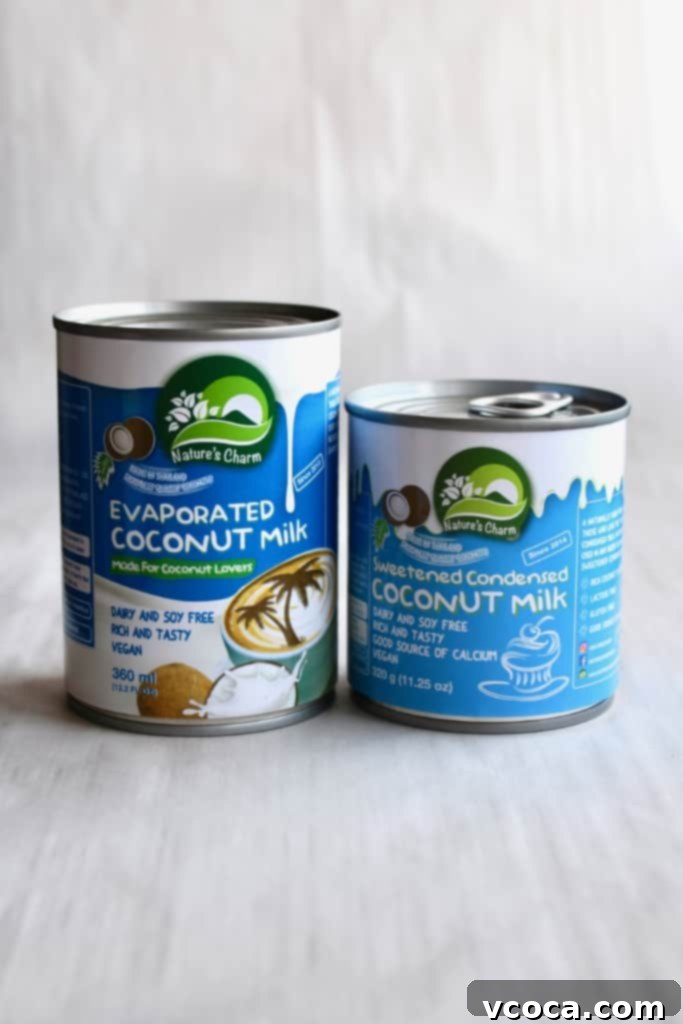 Cans of Nature's Charm condensed coconut milk and evaporated coconut milk, perfect for dairy-free baking
