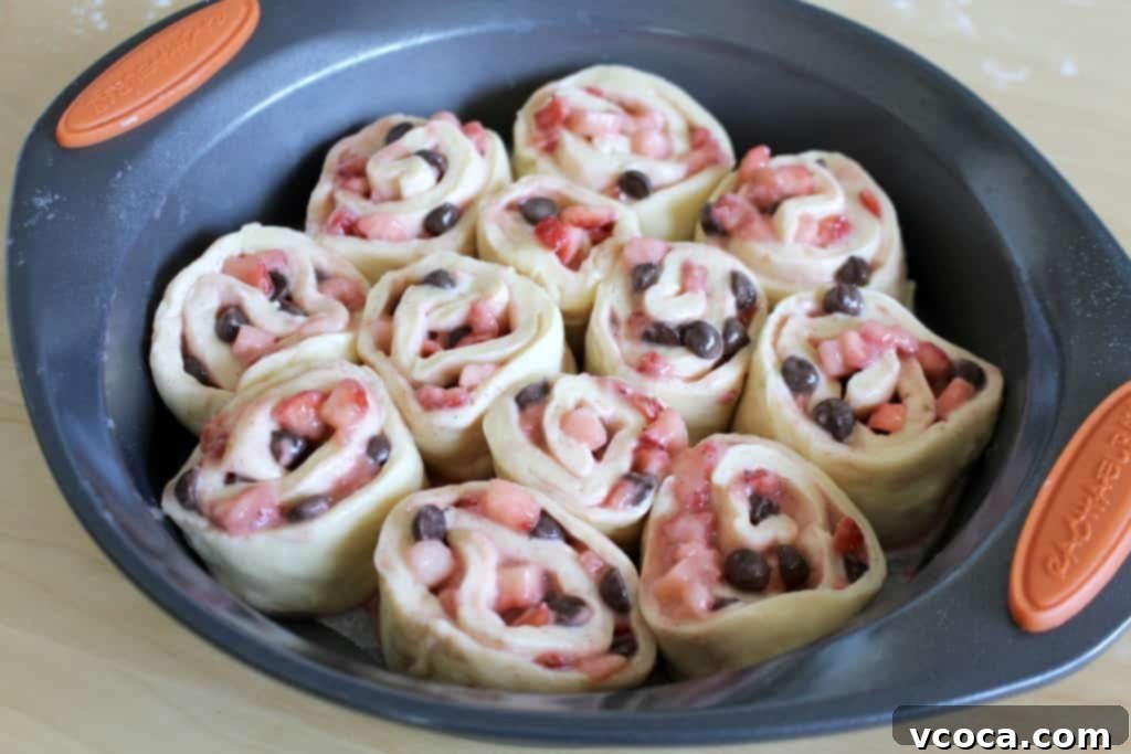 Decadent Strawberry Chocolate Rolls 6 Unbaked strawberry chocolate rolls arranged in a round baking pan