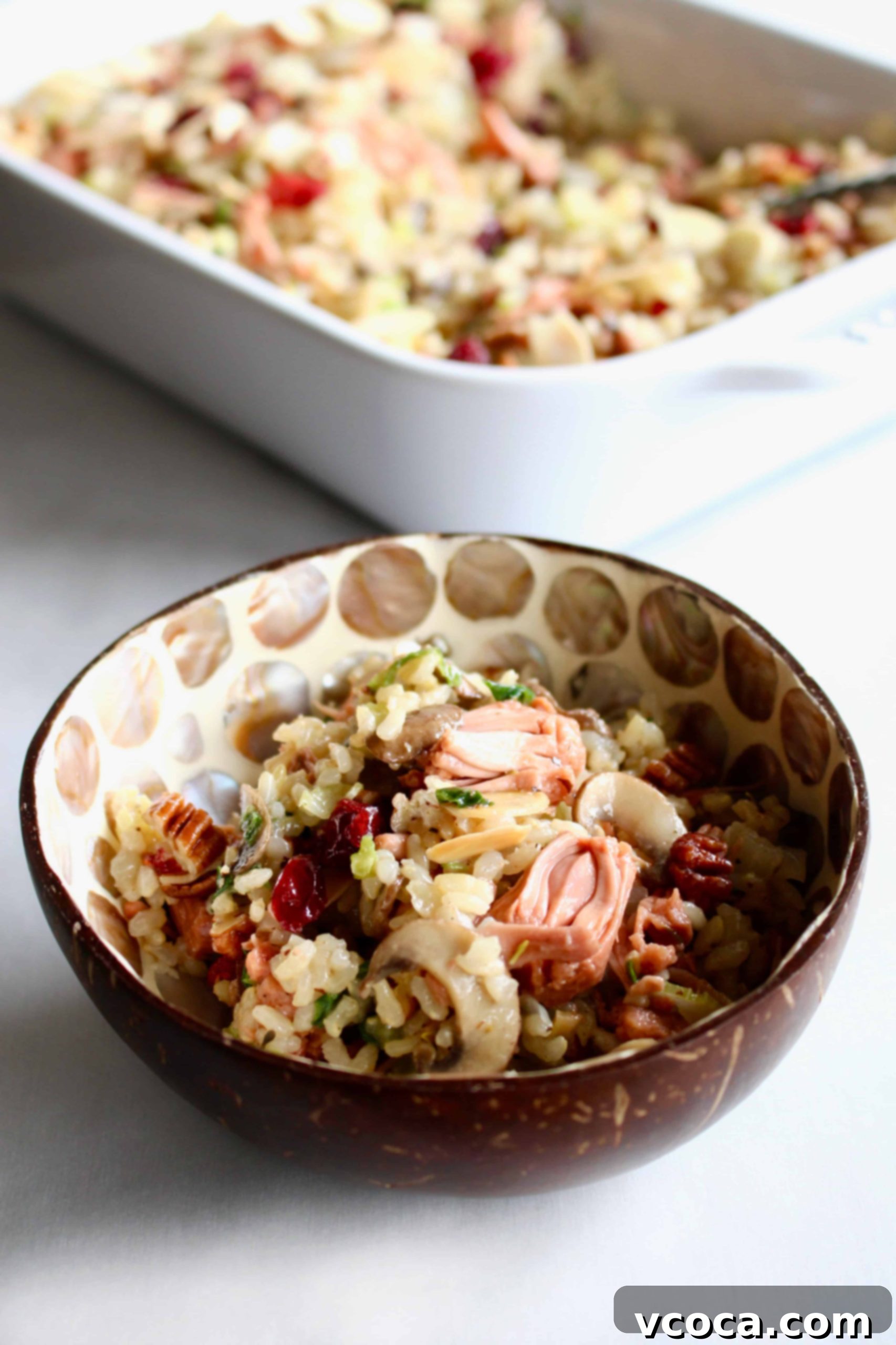 Effortless and Flavorful Vegan Gluten-Free Rice Stuffing 7 A vibrant bowl of ingredients for the ultimate vegan and gluten-free stuffing: cooked brown rice, sautéed vegetables, jackfruit, cranberries, and nuts. This healthy and easy recipe is a must-try for the holiday season.