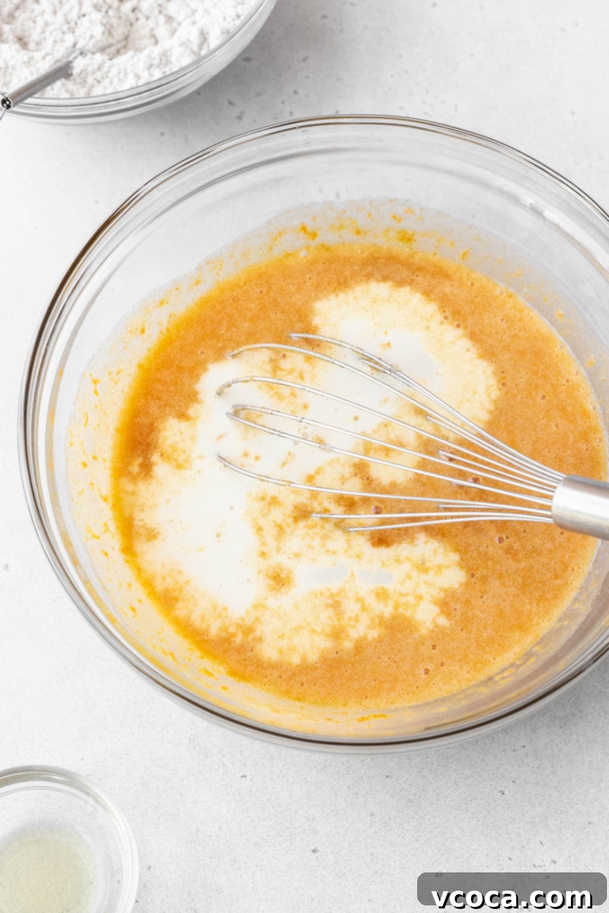 Spiced Sweet Potato Cake with Cashew Frosting 11 Non-dairy milk whisked into the glass bowl of wet ingredients.